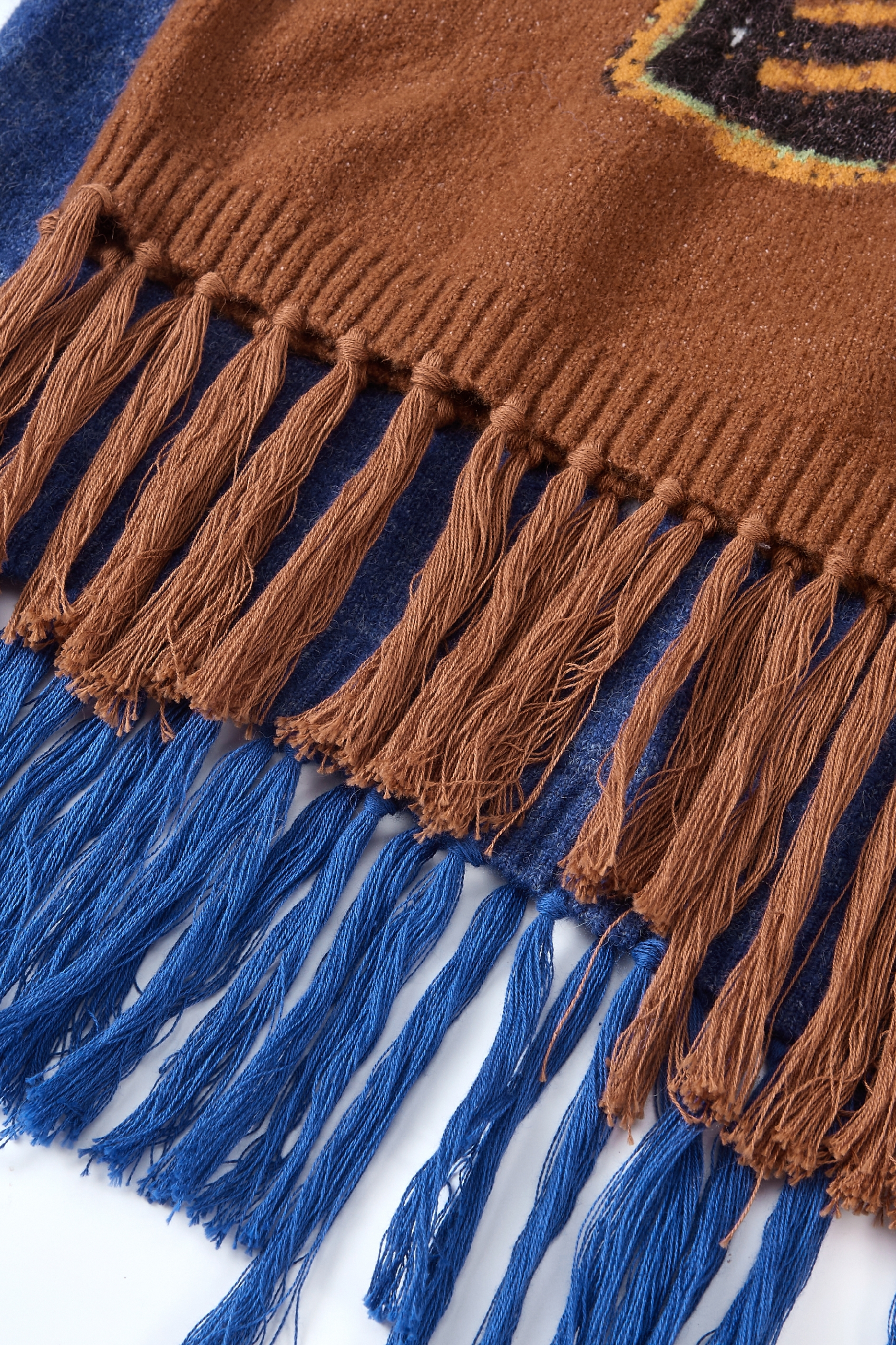 Round-neck jacquard sweater with tassels