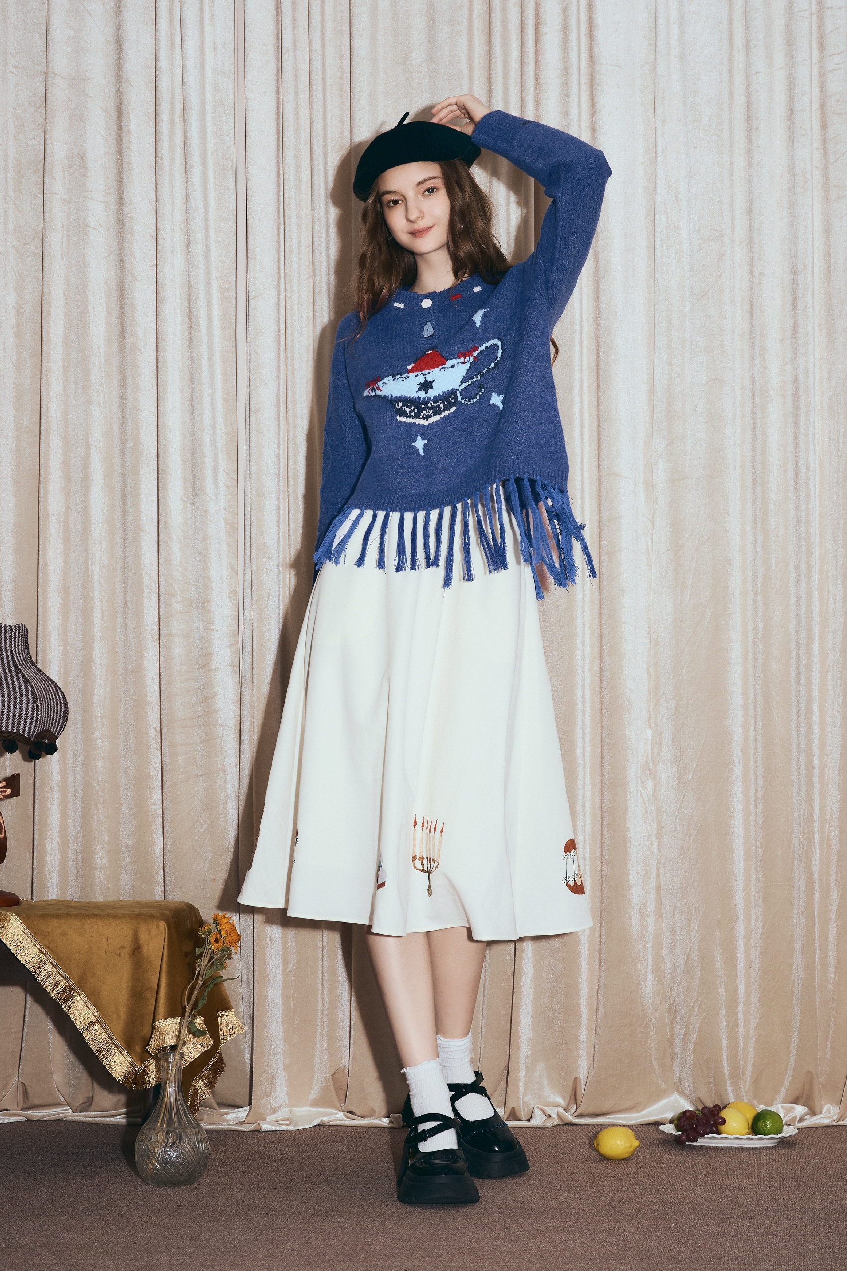 Round-neck jacquard sweater with tassels