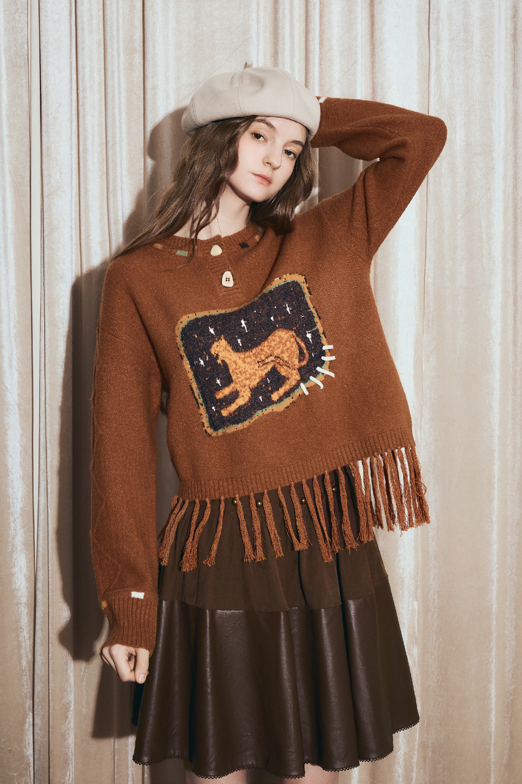 Round-neck jacquard sweater with tassels