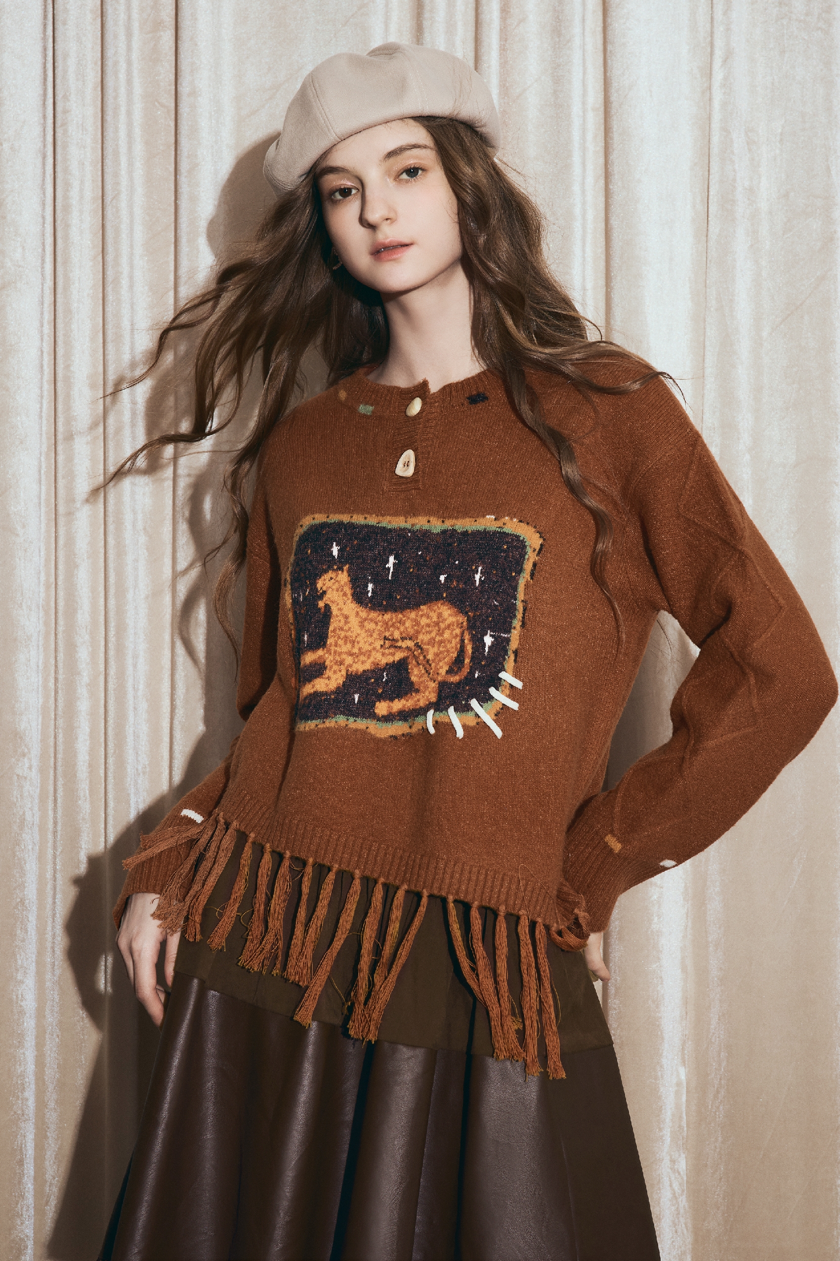 Round-neck jacquard sweater with tassels