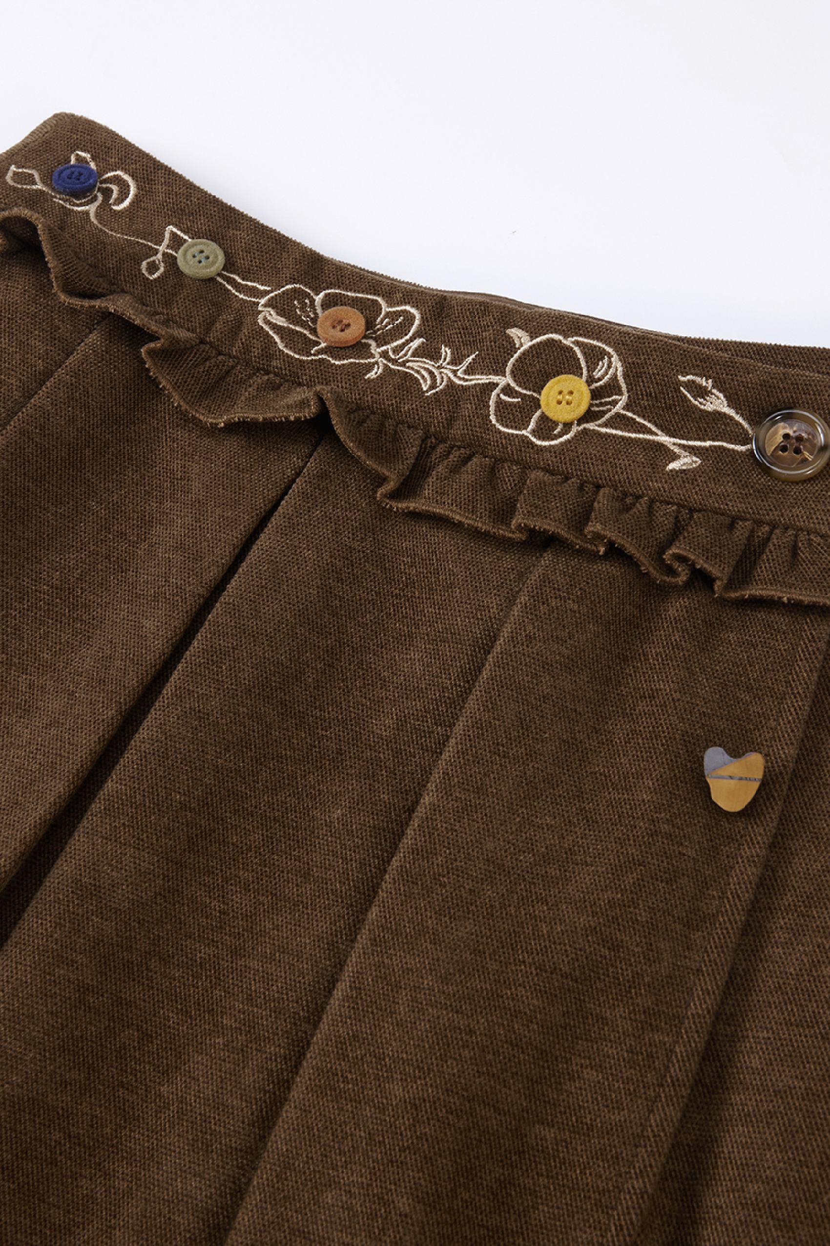 Asymmetrical pleated mini skirt