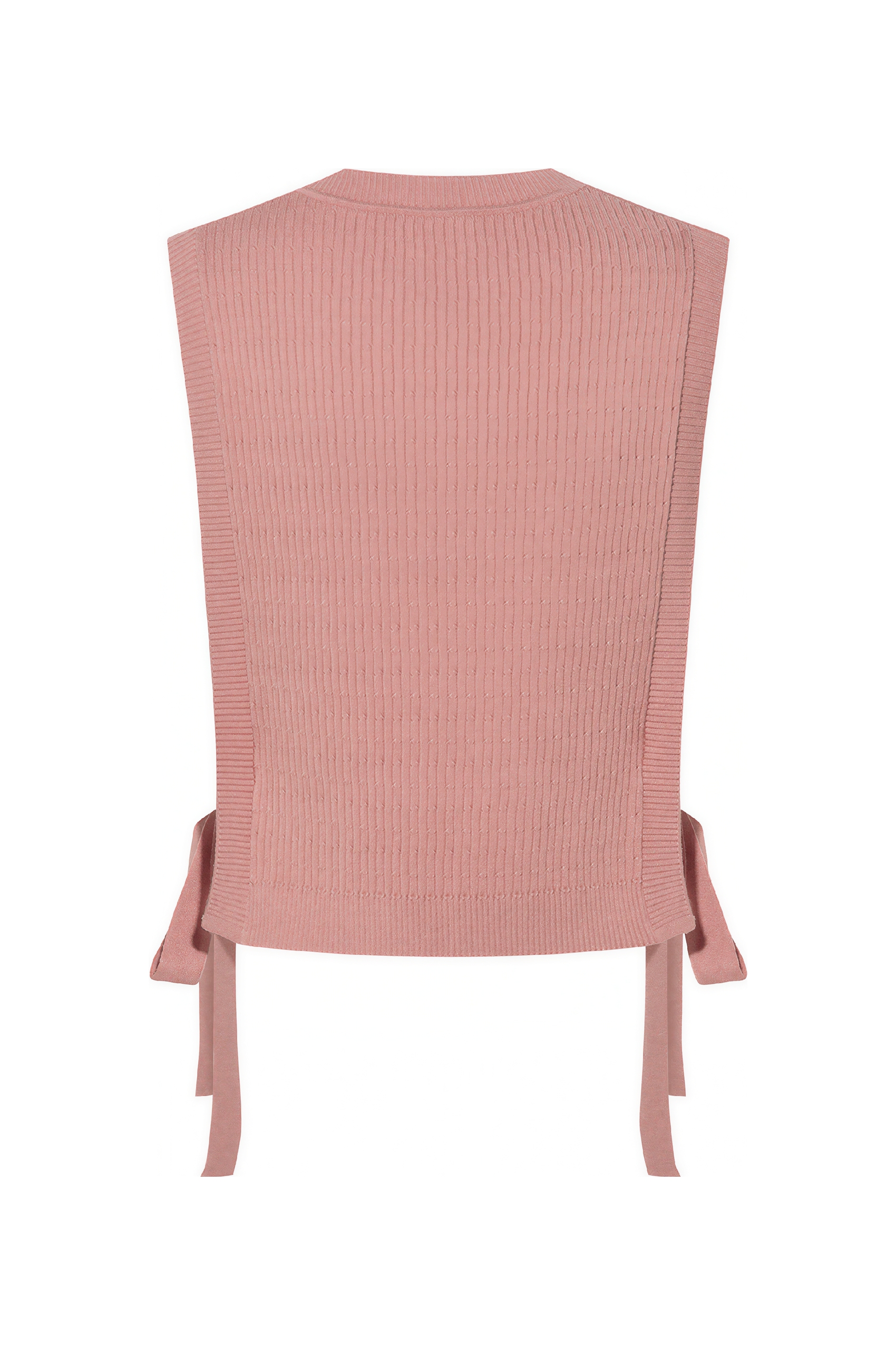 Short knitted vest worn over a tank top