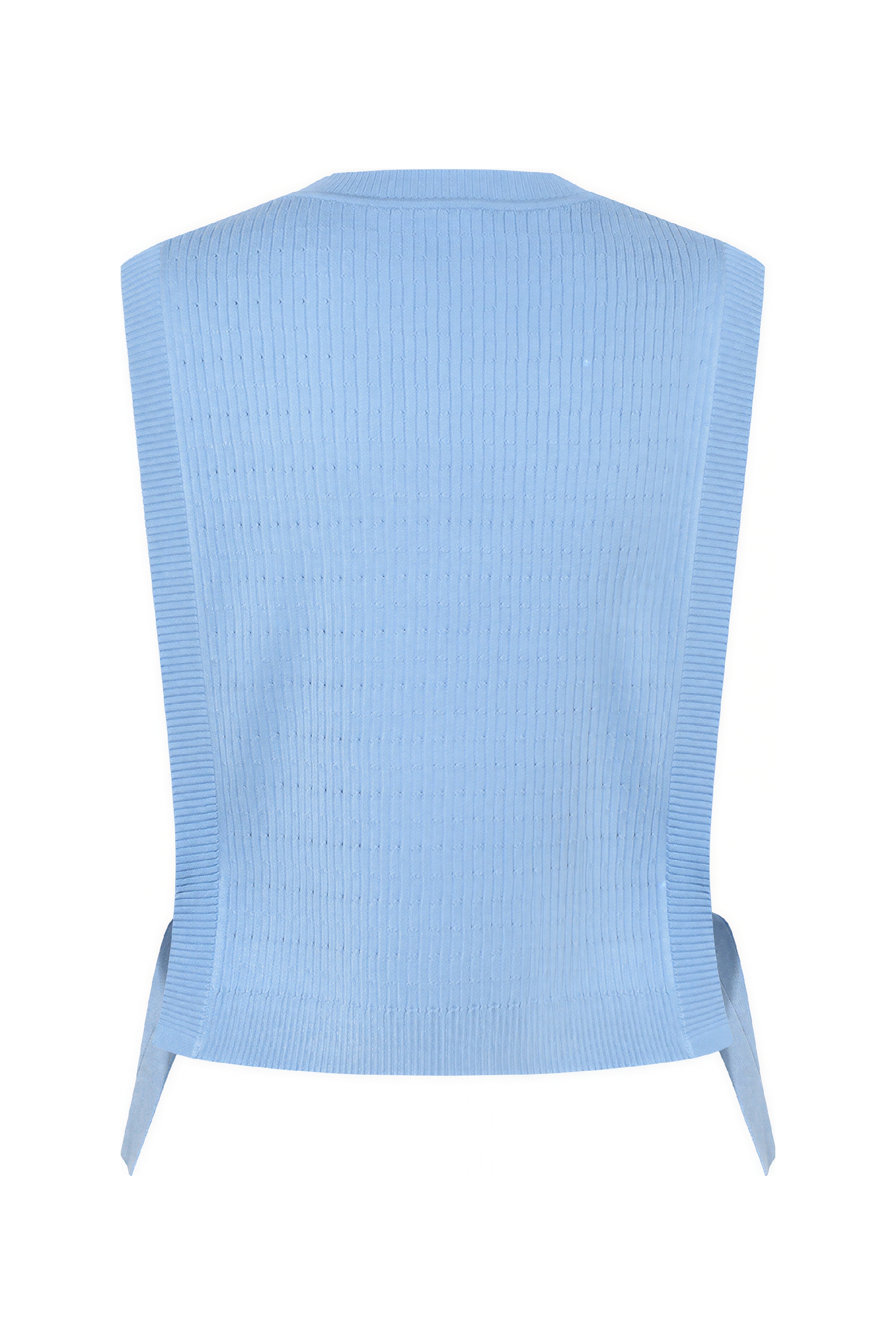 Short knitted vest worn over a tank top