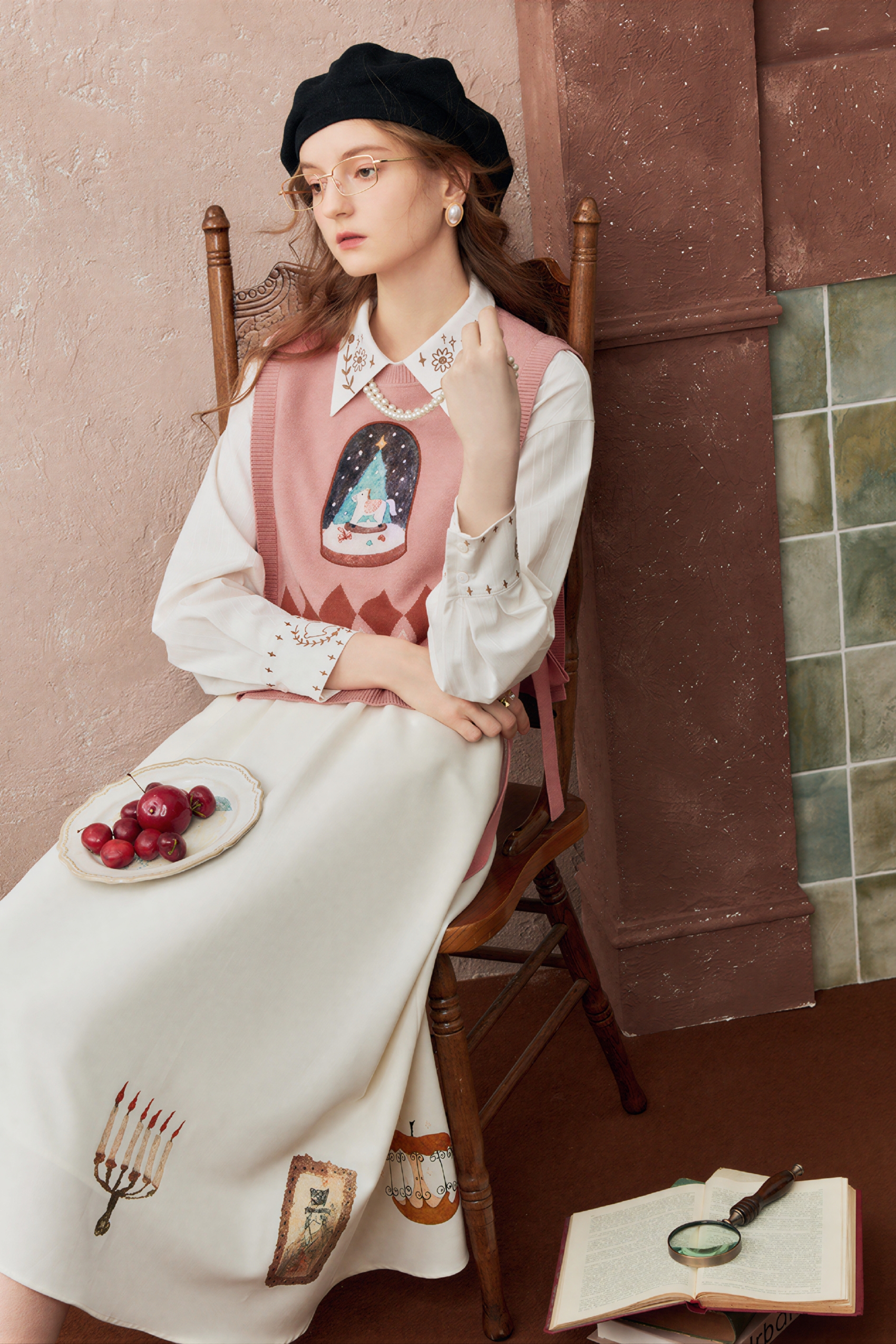 Short knitted vest worn over a tank top