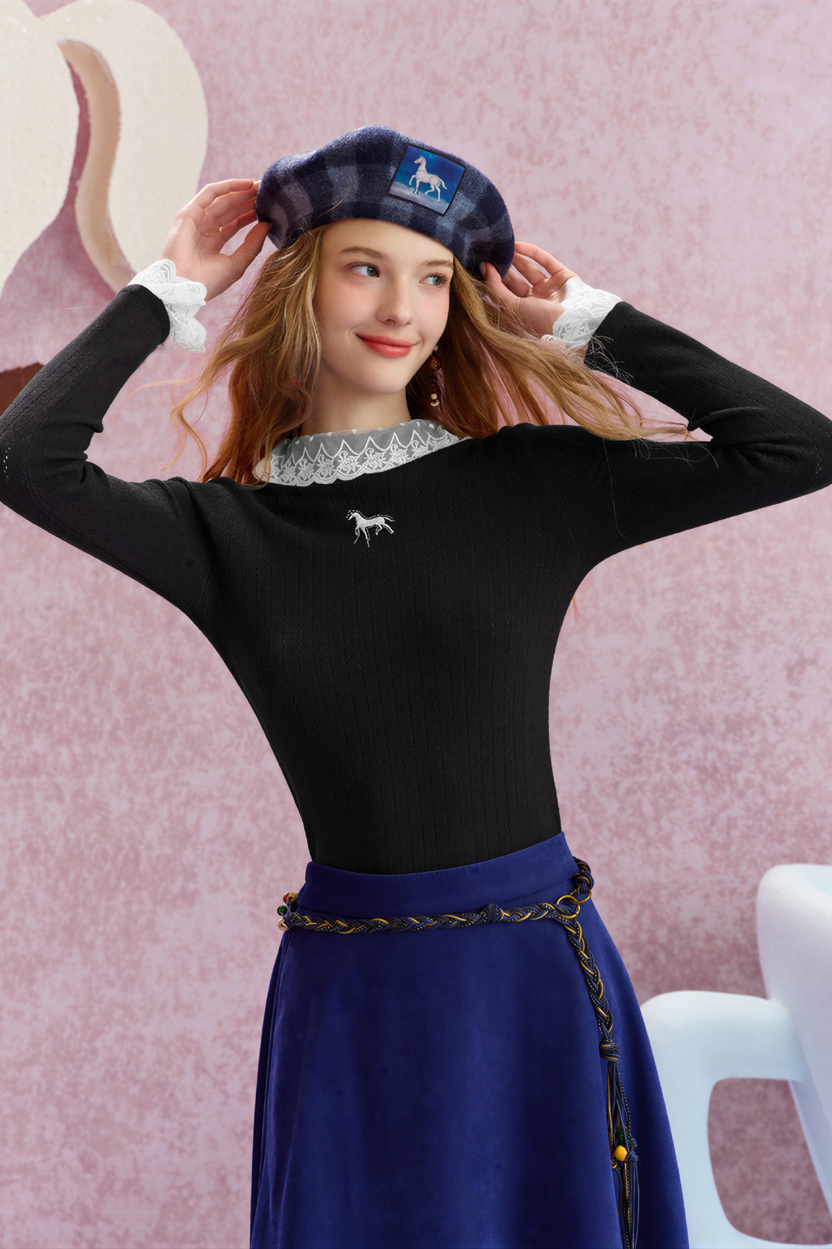 Worn with a fitted knit sweater underneath