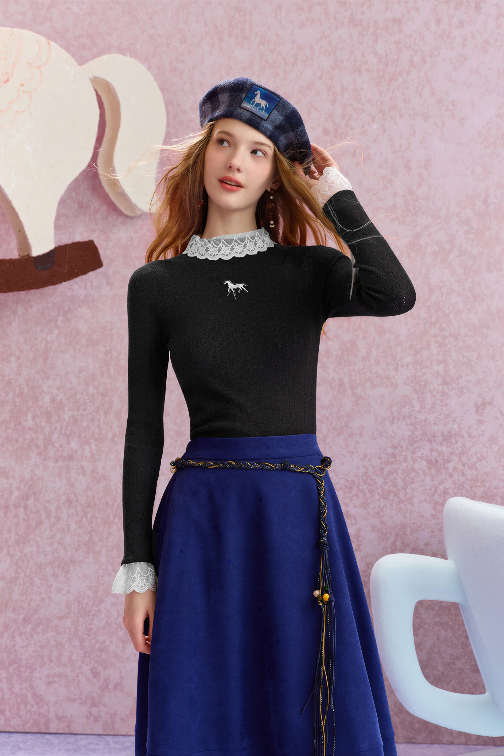 Worn with a fitted knit sweater underneath