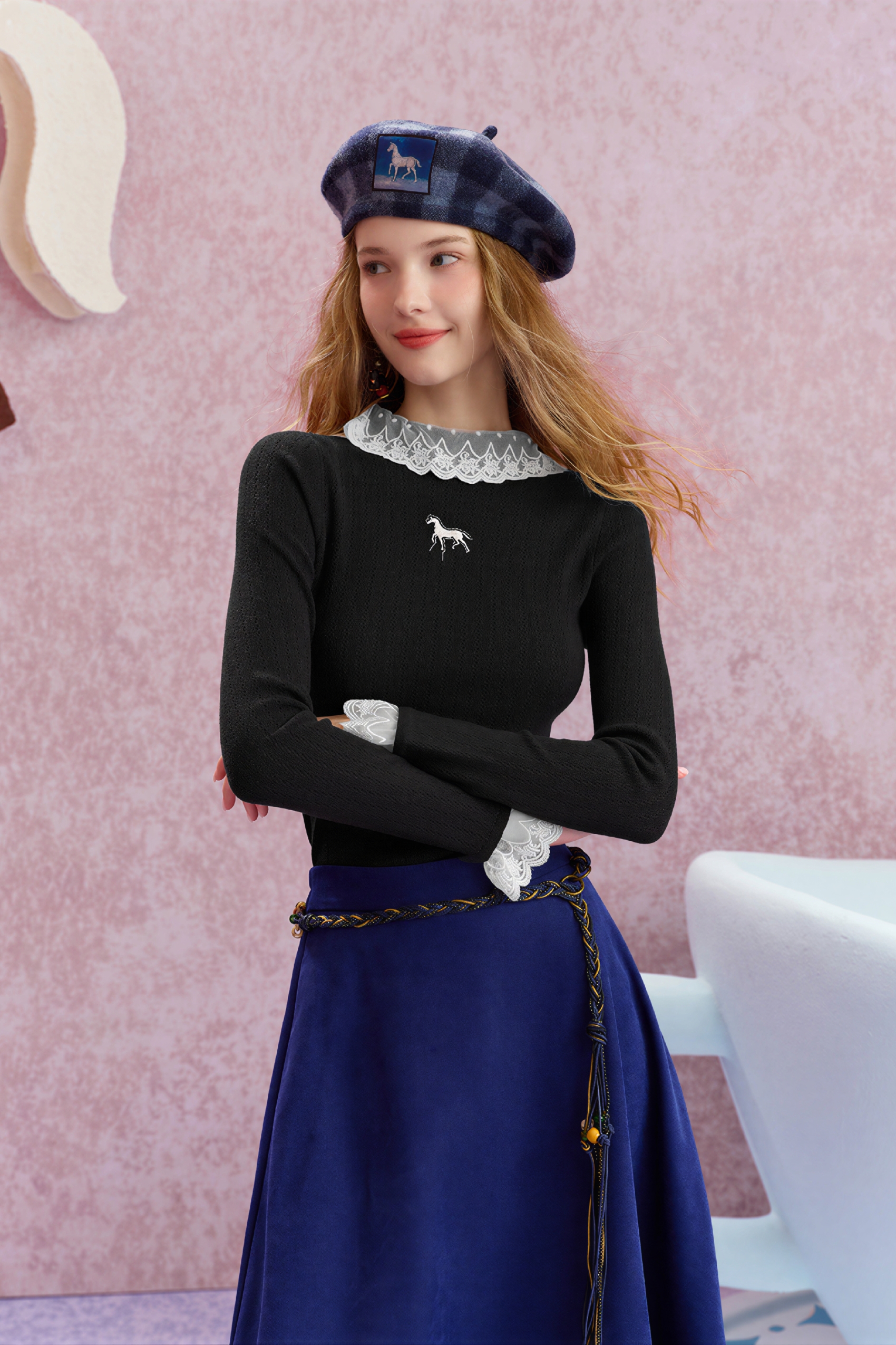 Worn with a fitted knit sweater underneath