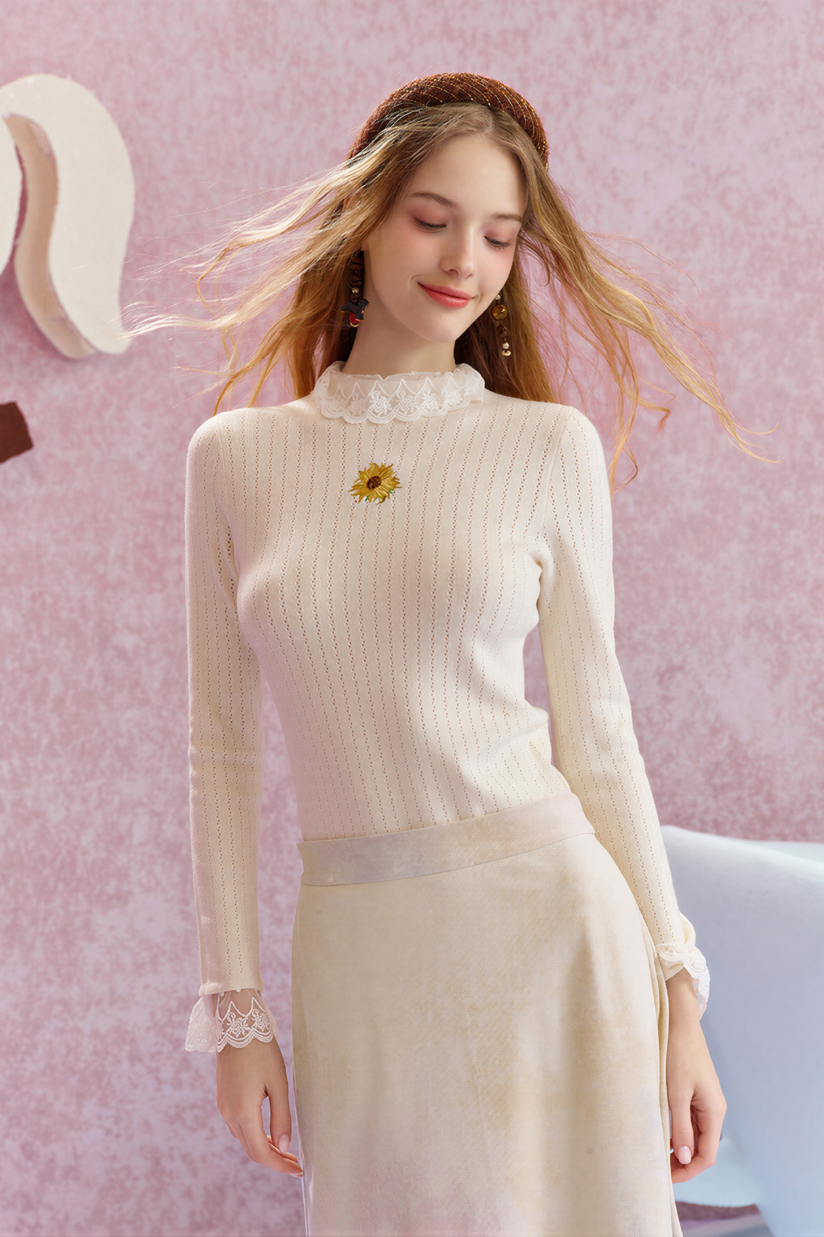 Worn with a fitted knit sweater underneath