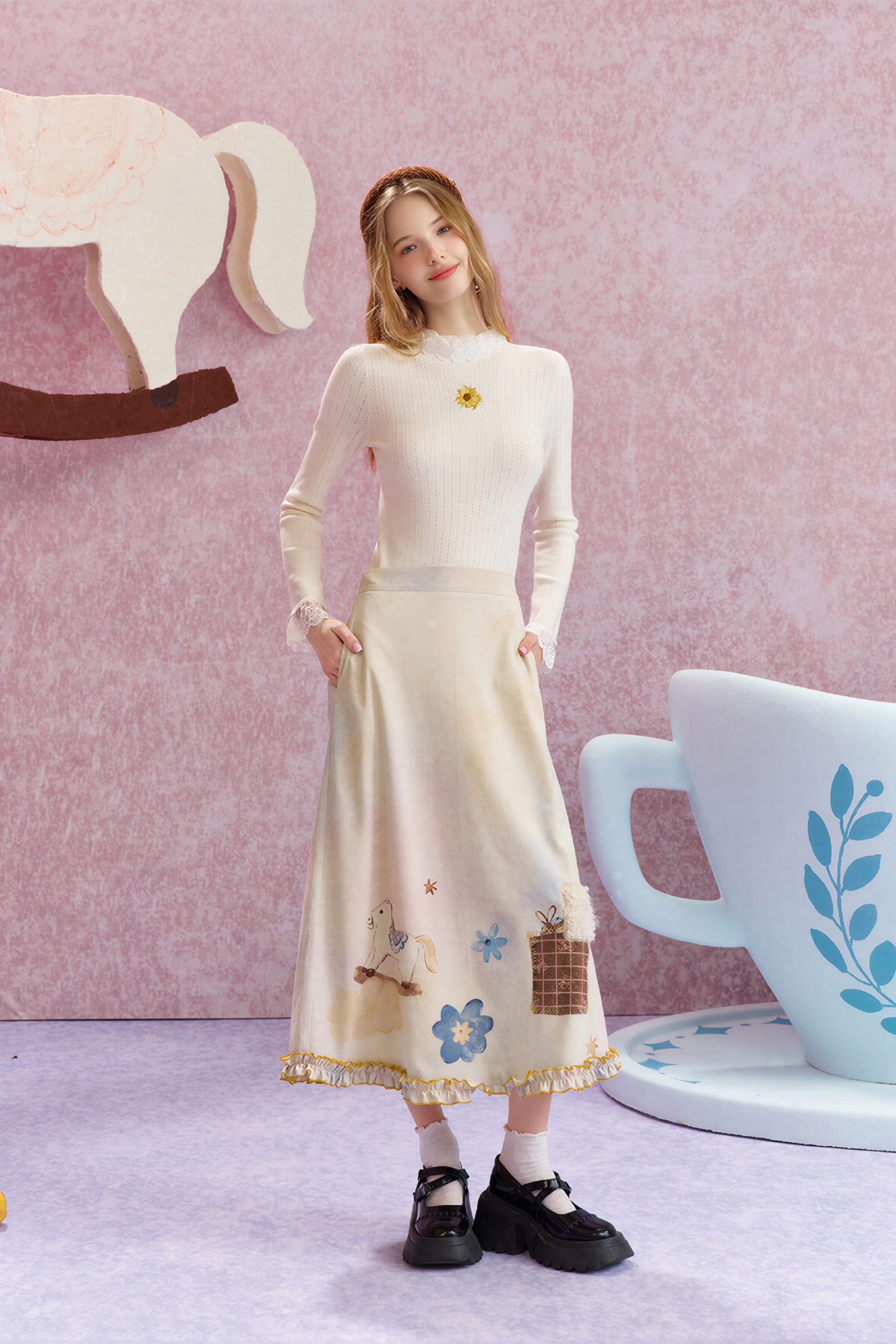 Worn with a fitted knit sweater underneath