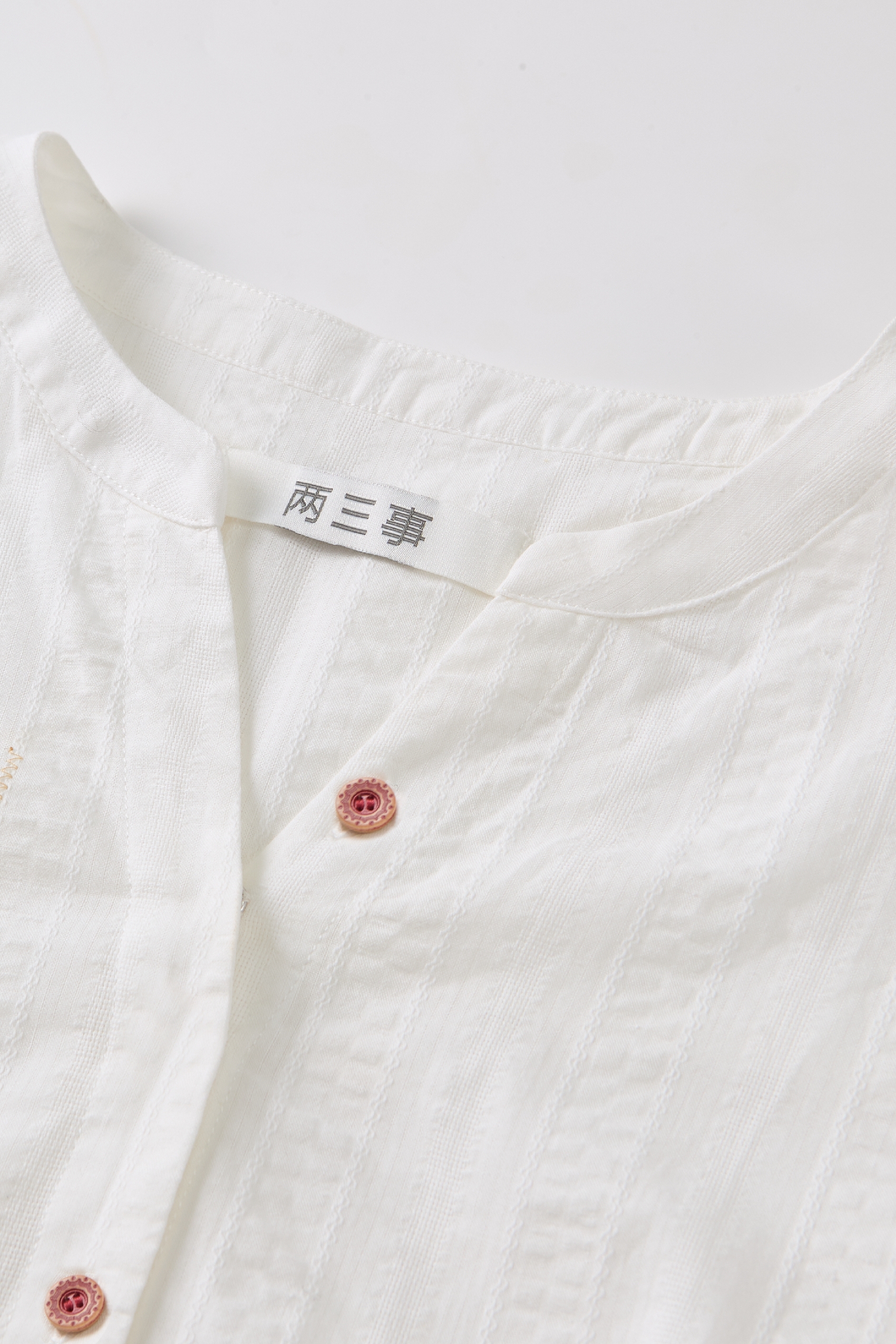White cardigan with button front detail