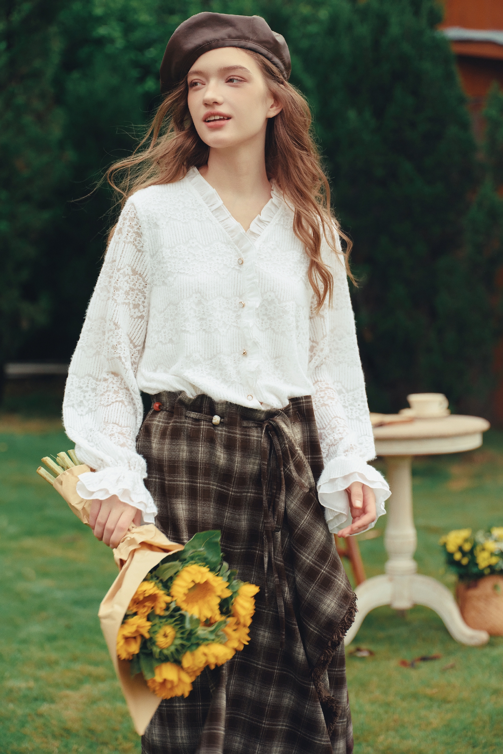White lace ruffle blouse with long sleeves and button front