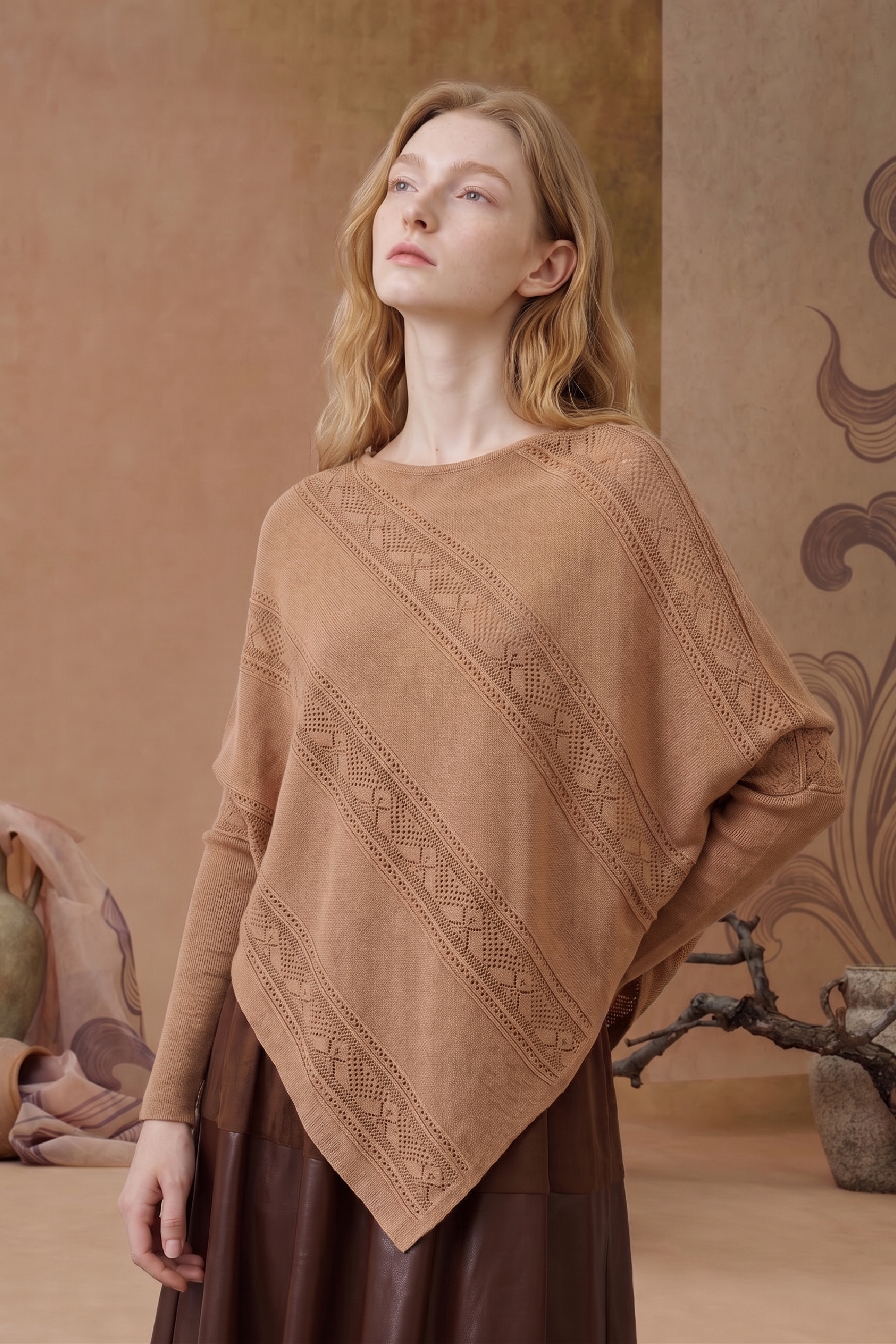 Brown asymmetric knit poncho sweater with textured openwork details