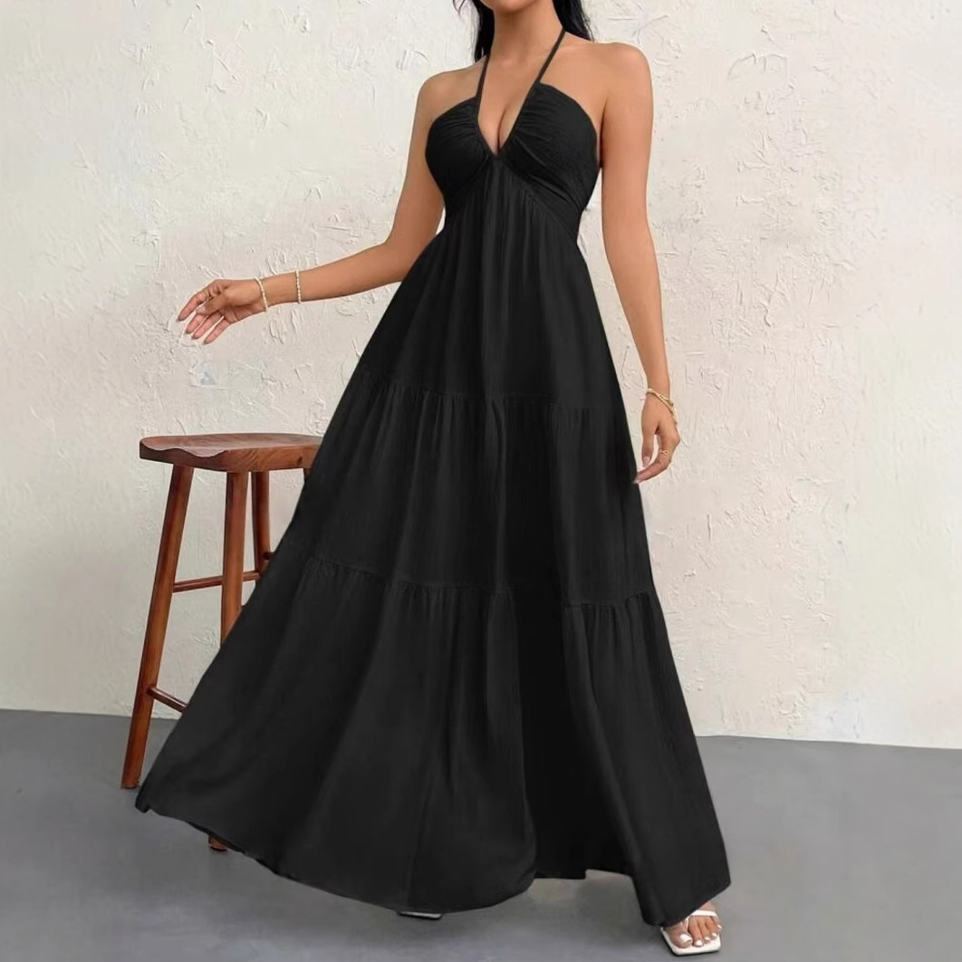 Sleeveless crepe dress with tie-neck and open back.