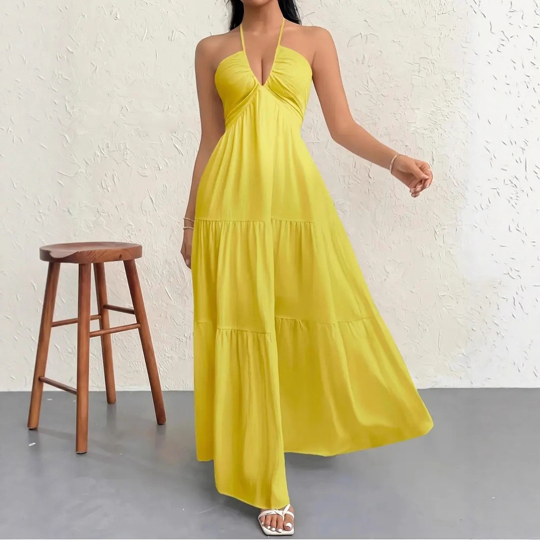 Sleeveless crepe dress with tie-neck and open back.