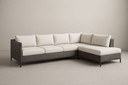 Divano angolare in rattan sintetico con cuscini in tessuto beige, struttura in metallo