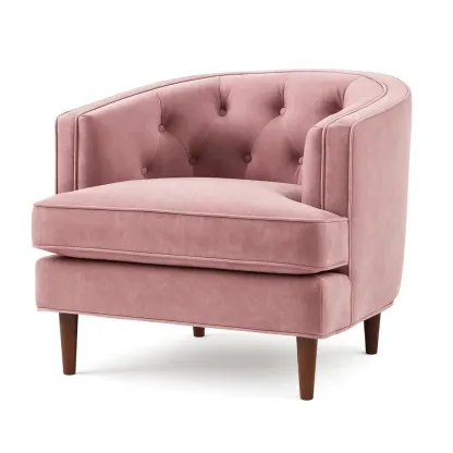 Fauteuil en velours rose avec pieds en bois