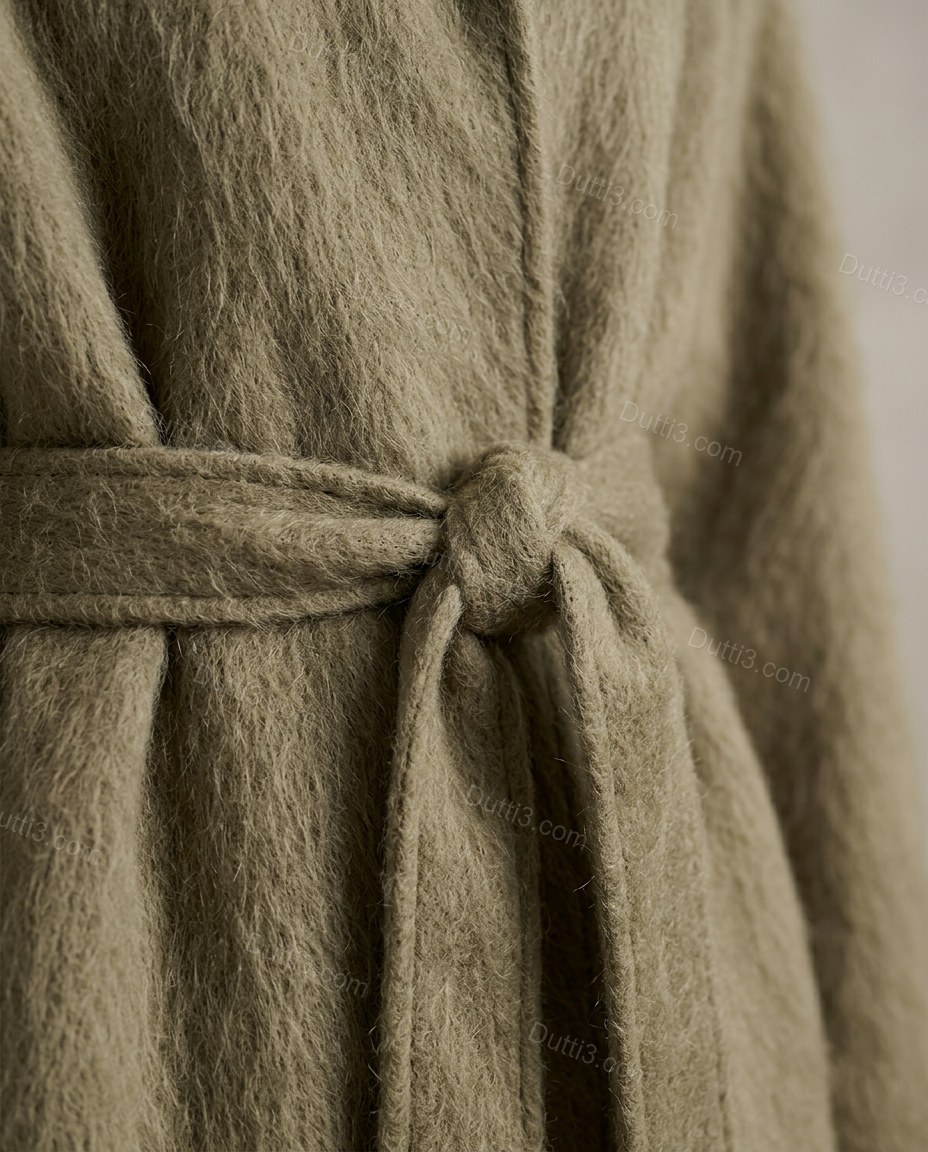 Muted Taupe Olive Coat, close-up of self-tie belt, notched lapel and broad folded collar, by Dutti3