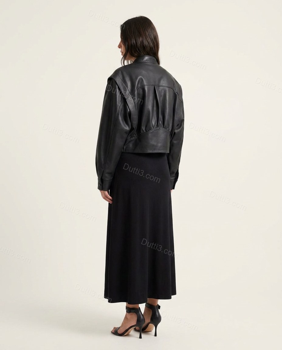 Black Midi Pleated Asymmetric Jacket & Skirt Set, back studio view showing jacket features a back yoke with vertical pleats for volume, by Dutti3