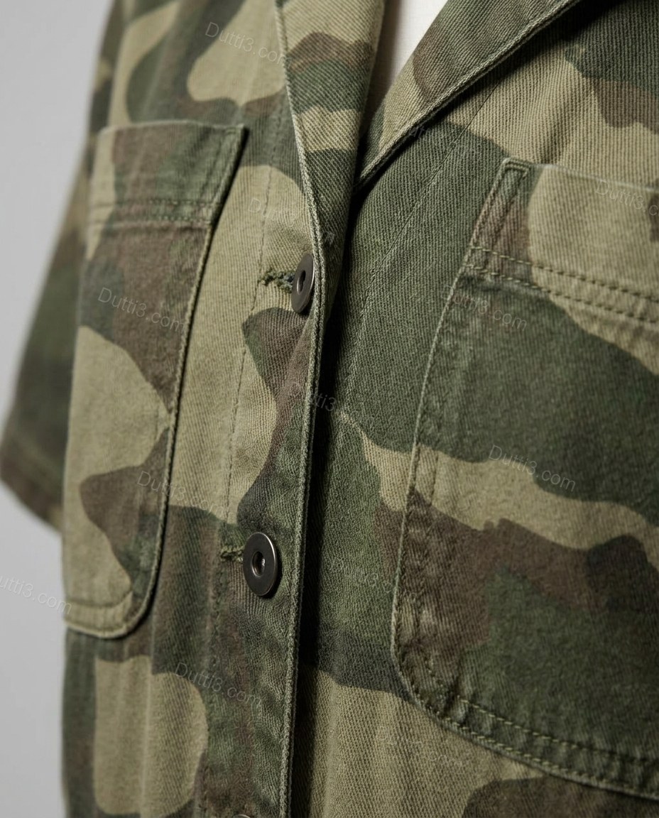 Green Jumpsuit, close-up of beige and brown accents, button-front closure and chest flap pockets, by Dutti3