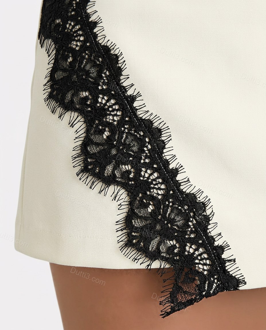 Cream Asymmetric Lace Two-Piece Set, close-up of black accents, double-breasted button closure and high stand collar, by Dutti3