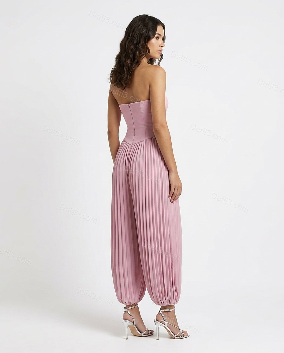 Pink Strapless Pleated Jumpsuit, back studio view showing fitted bodice with v-shaped drop-waist seam, by Dutti3