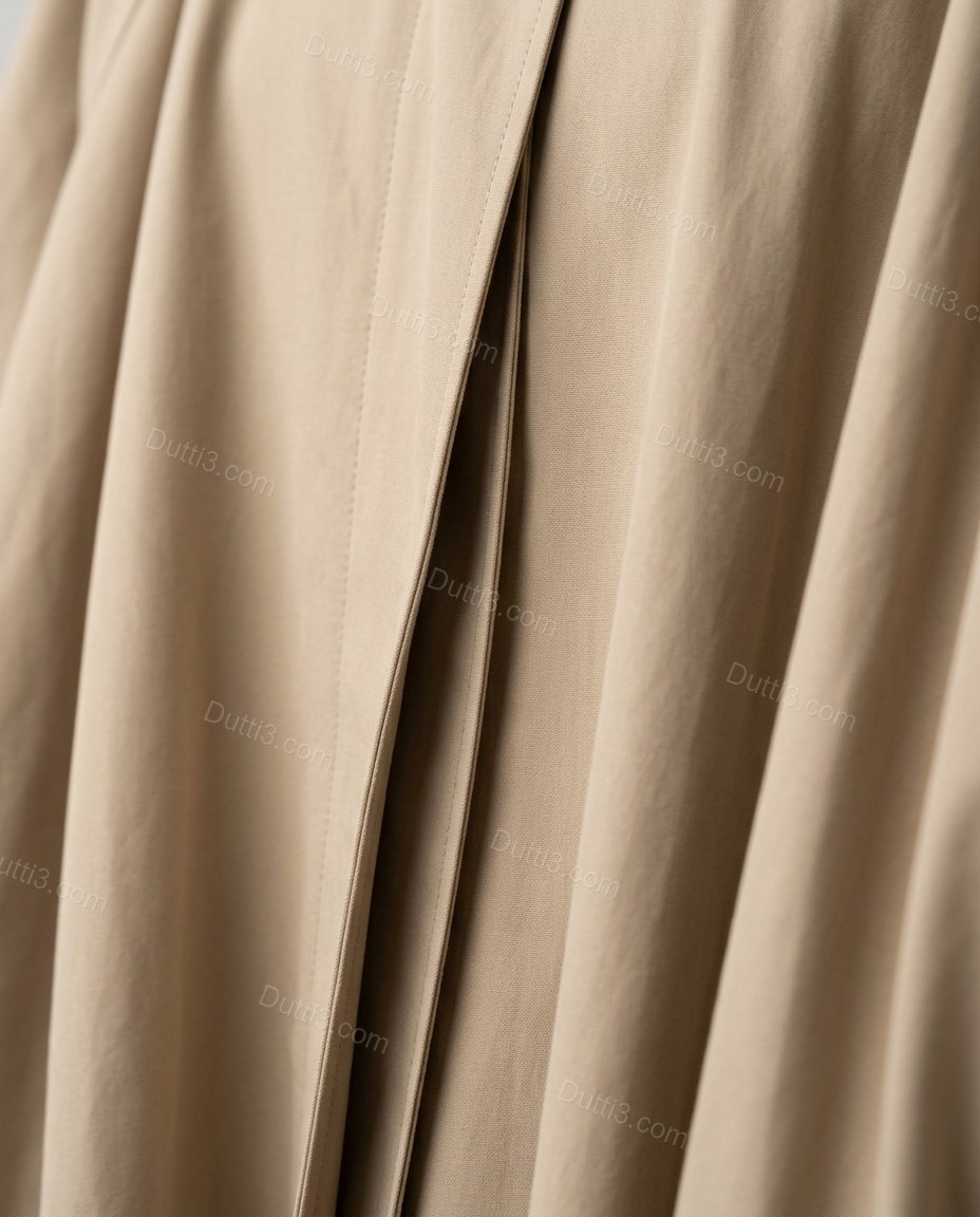 Beige Coat, close-up of gathered cuffs, draped front panels and high standing collar, by Dutti3