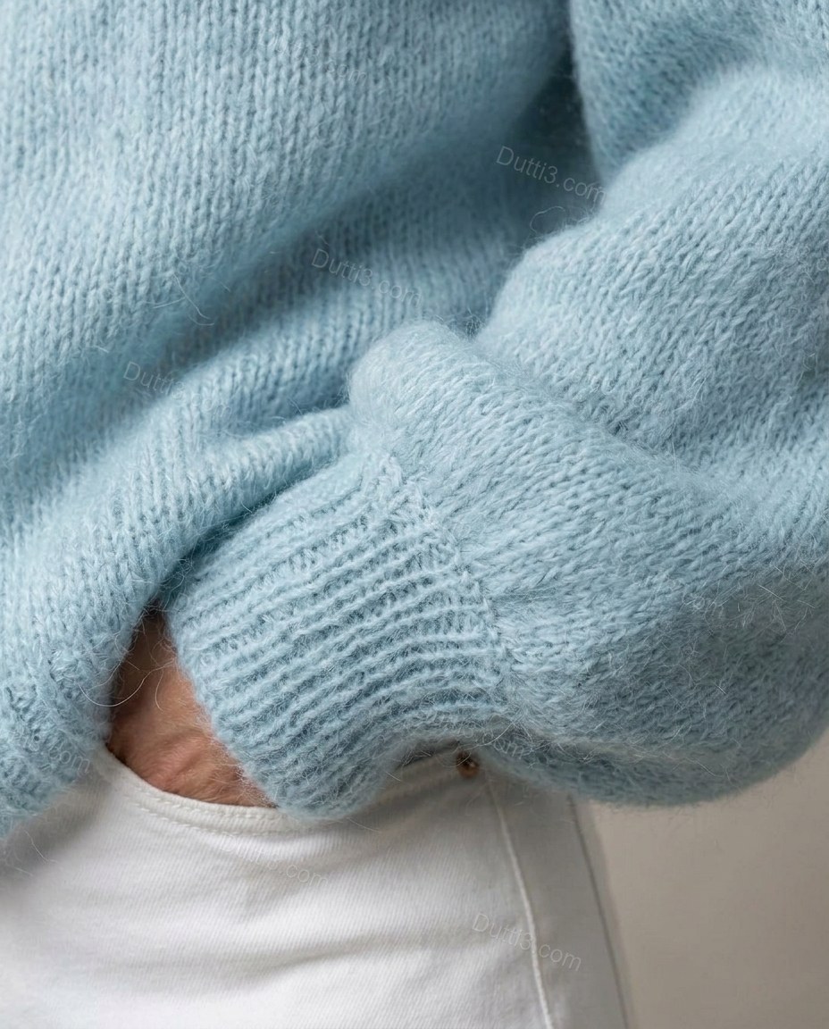 Light Blue Knit Cardigan, close-up of button closure, v-neck and drop shoulder, by Dutti3