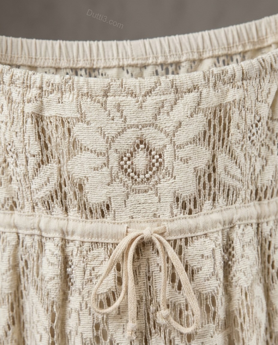 Ivory Floral Maxi Open-Back Dress, close-up of floral embroidery and scalloped hem, by Dutti3