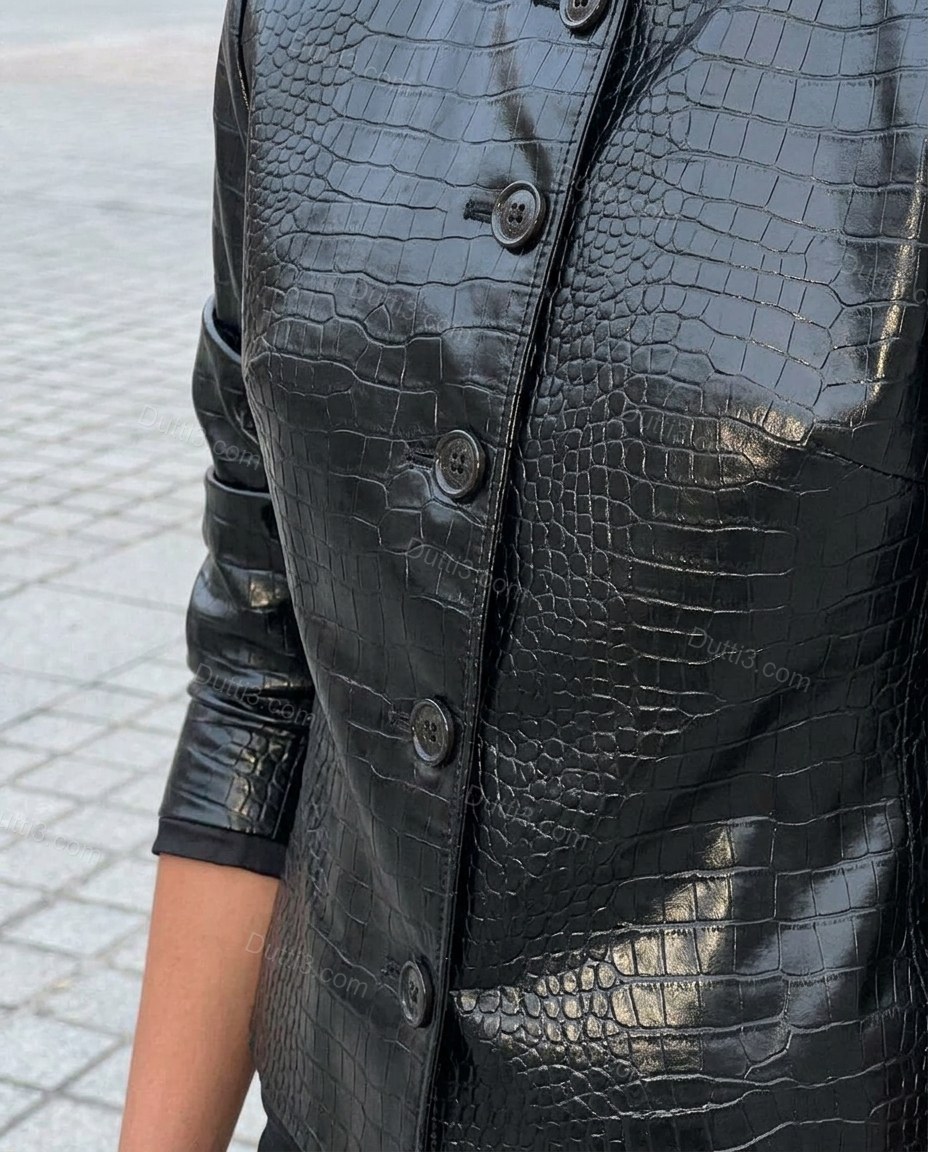 Black Peplum Jacket, close-up of button closure, crocodile embossed texture and cropped length, by Dutti3