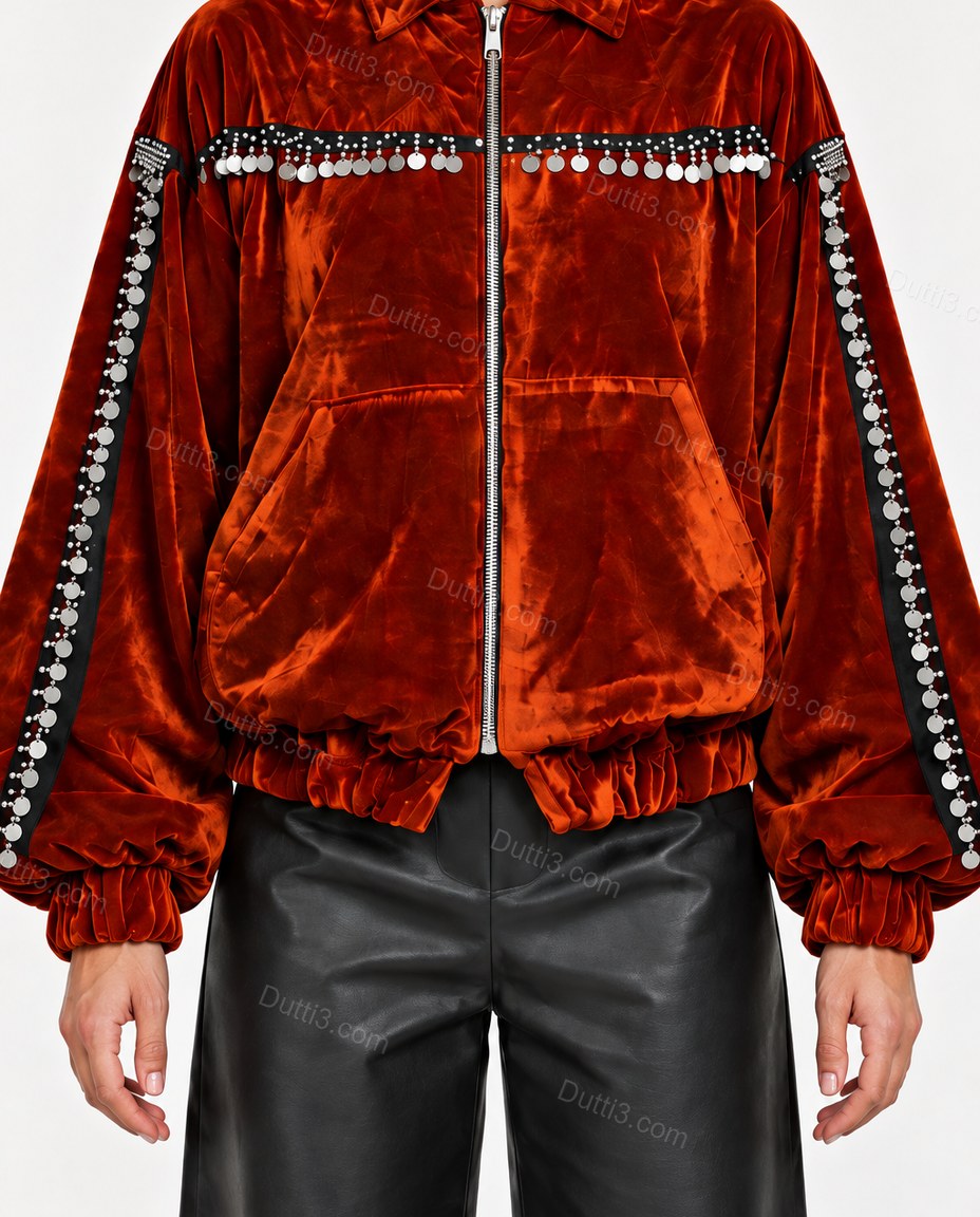 Rust Velvet Jacket, close-up of orange and silver accents, front zipper closure and elasticated hem, by Dutti3