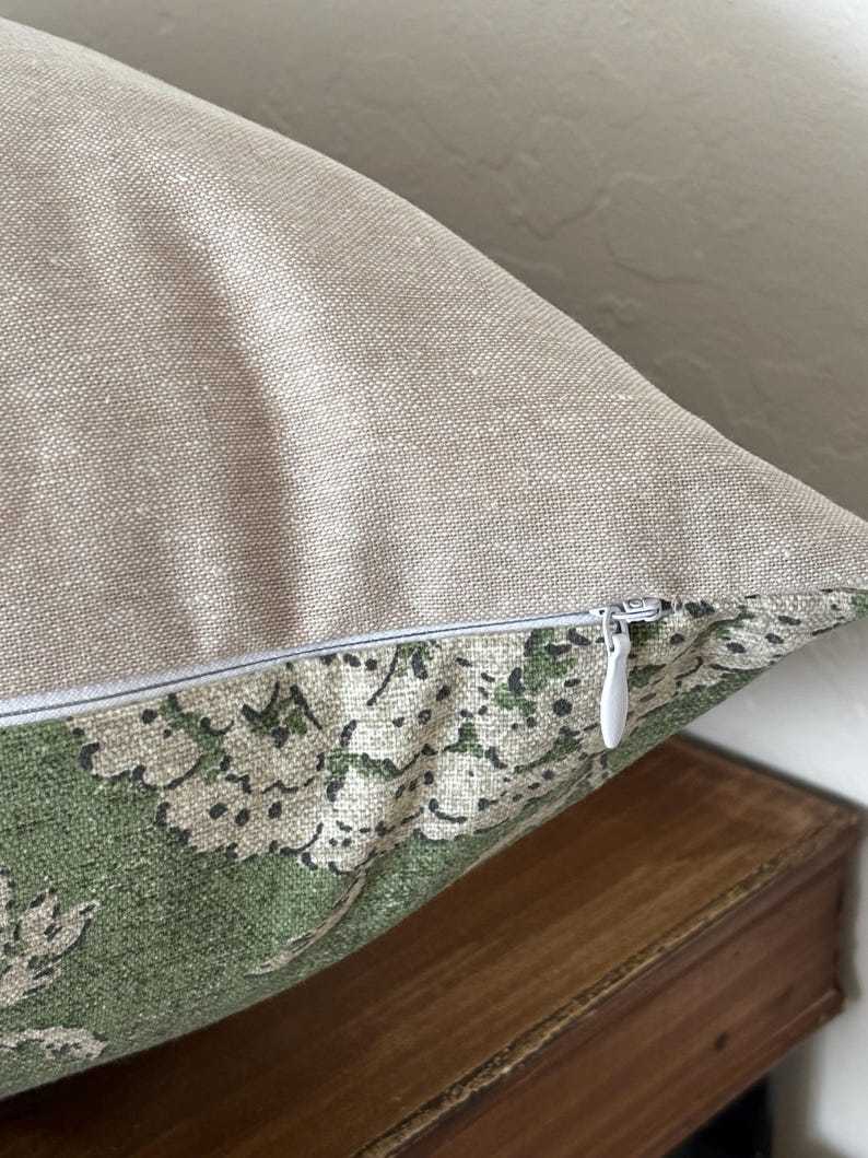 Pillow cover sham cushion in an earthy green with tan taupe flowers. Linen and cotton fabric. Bottom hidden zipper. Made to order.