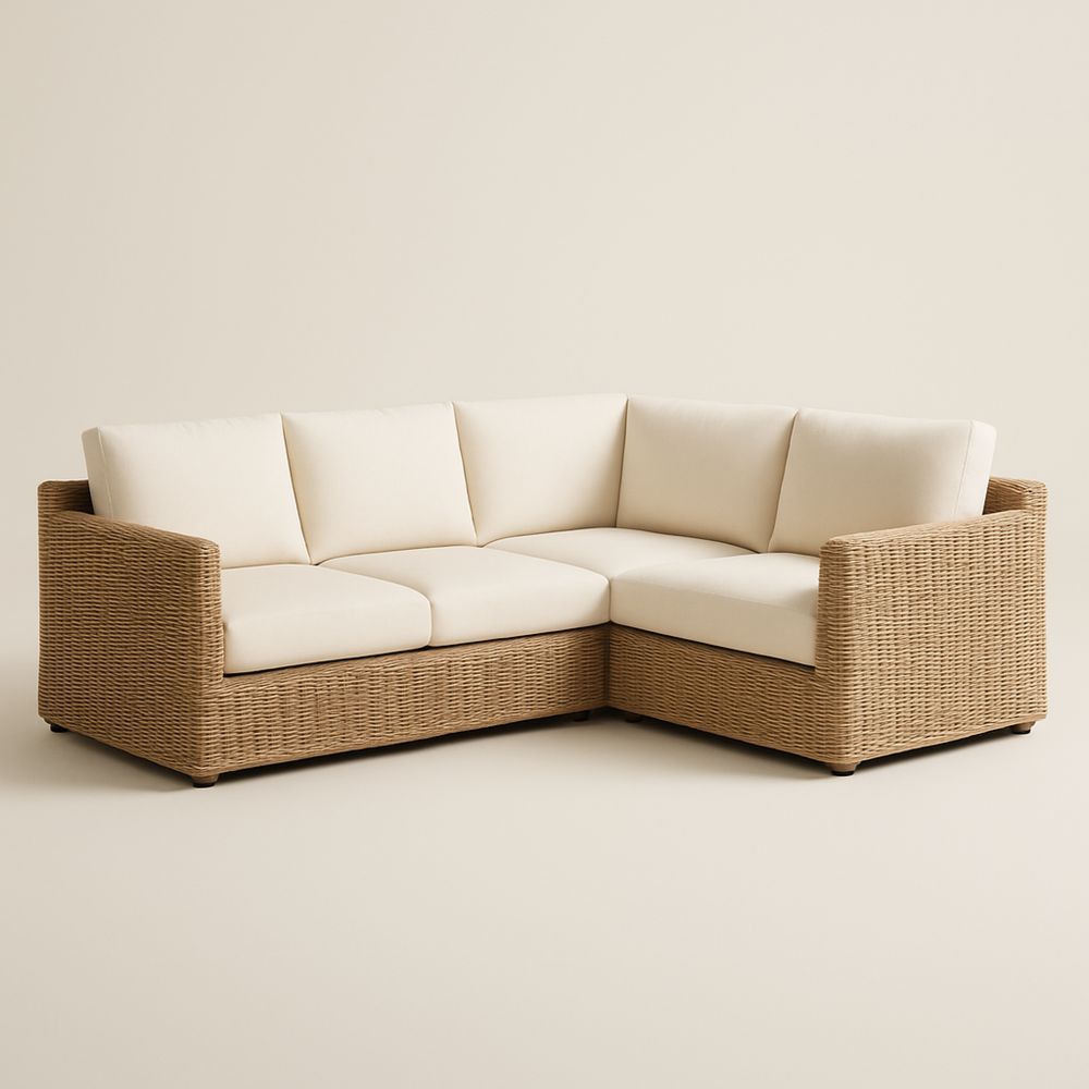 Divano angolare in rattan con cuscini bianco crema