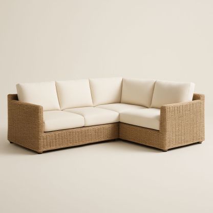 Divano angolare in rattan con cuscini bianco crema