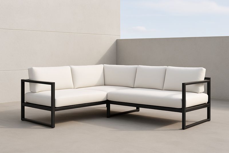 Divano angolare da esterno in alluminio e cuscini bianchi