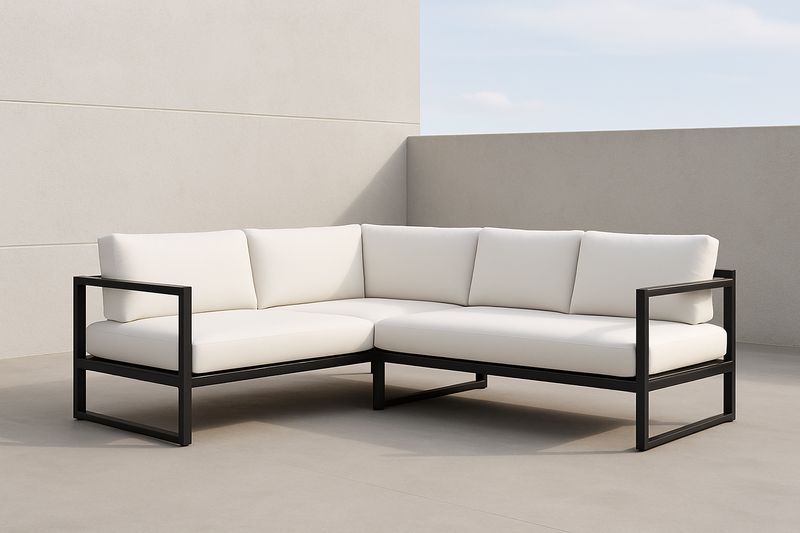 Divano angolare da esterno in alluminio e cuscini bianchi