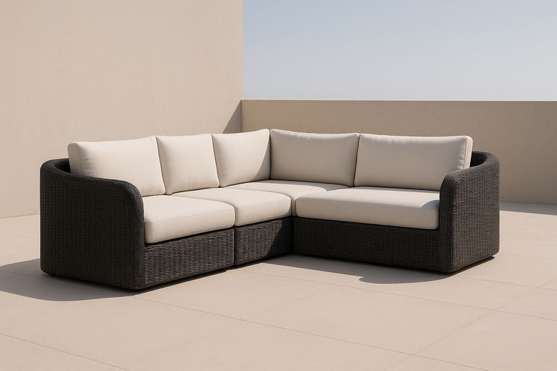 Divano angolare da esterno in rattan sintetico con cuscini beige