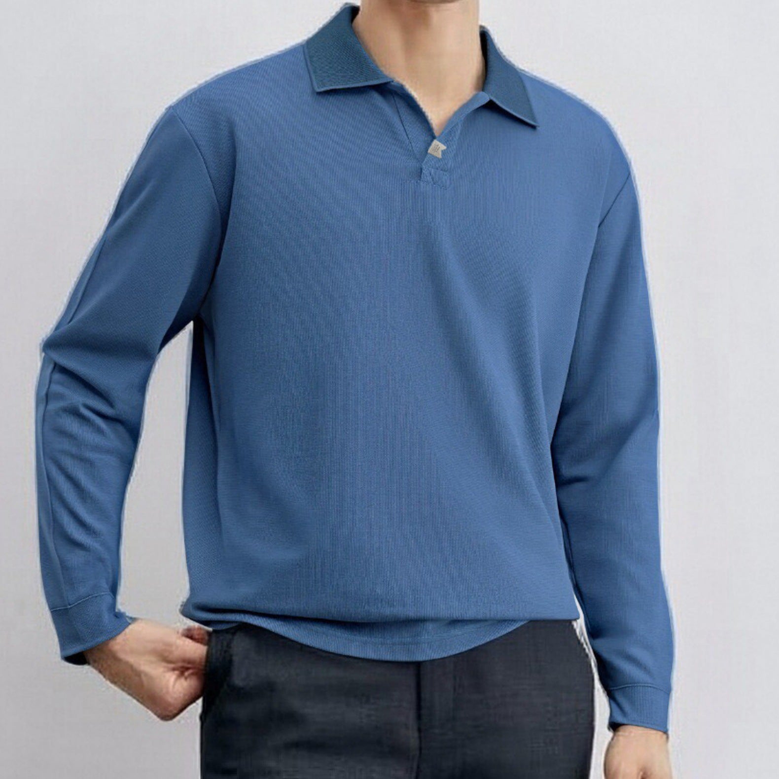 Loose-fitting, casual long-sleeved men's polo shirt with a collar.