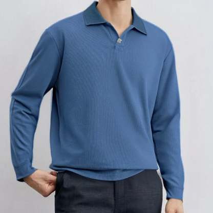 Loose-fitting, casual long-sleeved men's polo shirt with a collar.
