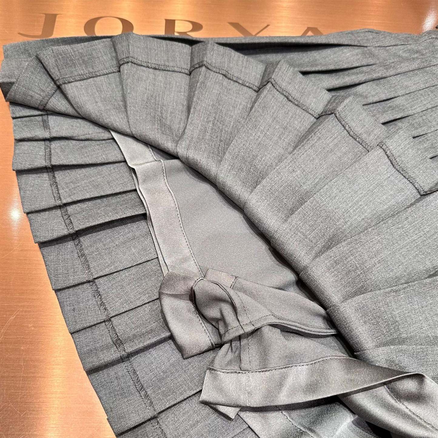 A-line pleated skirt with a belt