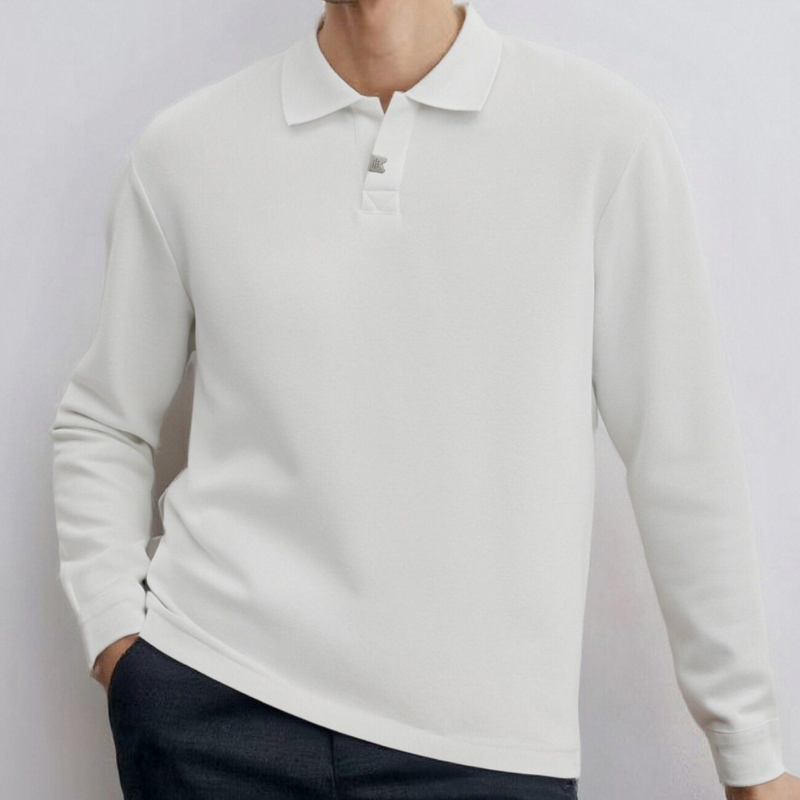 Loose-fitting, casual long-sleeved men's polo shirt with a collar.