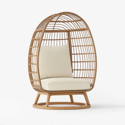 Poltrona a uovo in rattan con cuscini bianchi