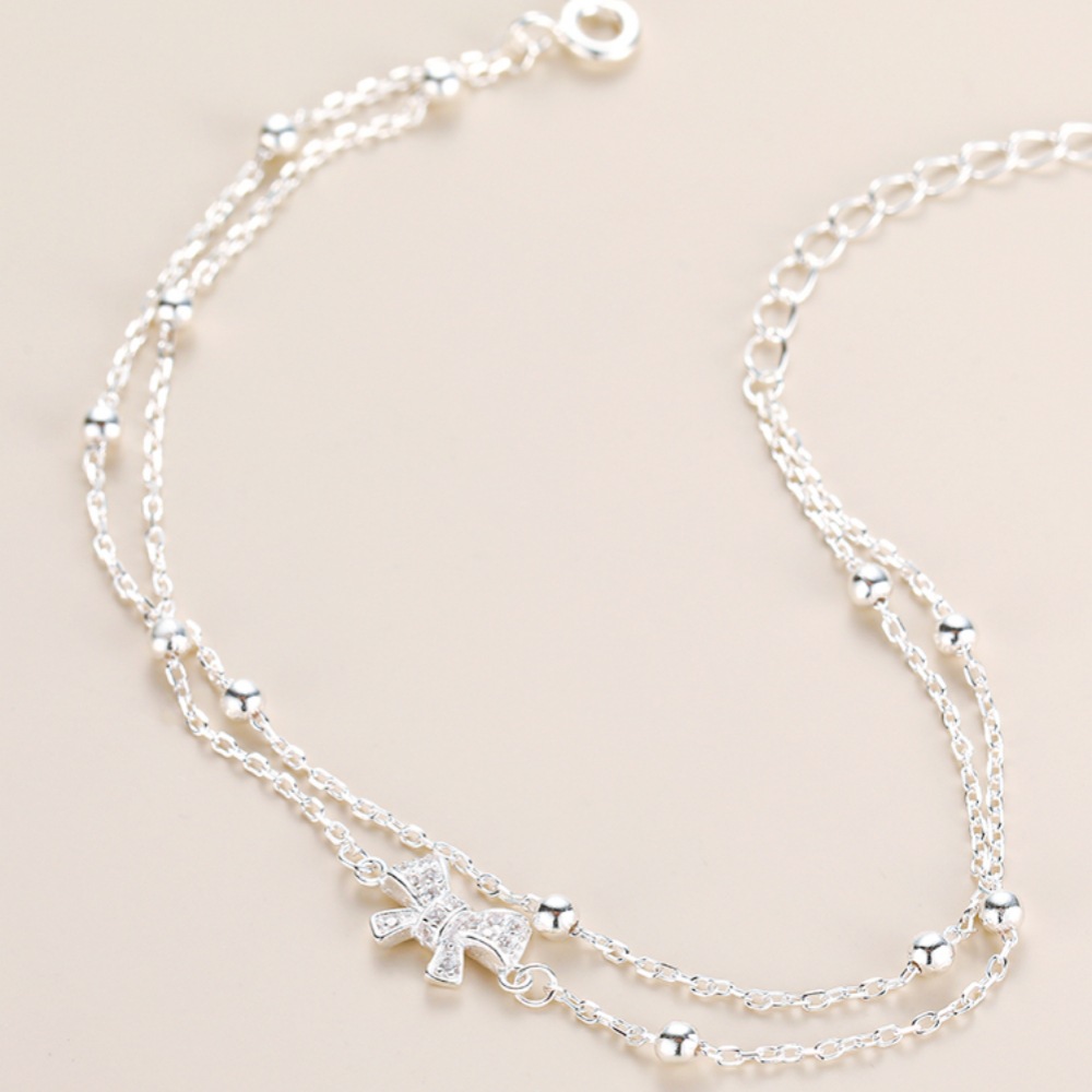 Bow - Accented Silver Bracelet | Double - Layered Whimsy for Your Wrist