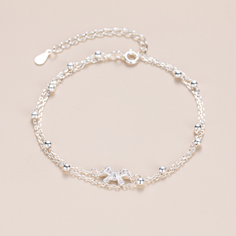 Bow - Accented Silver Bracelet | Double - Layered Whimsy for Your Wrist