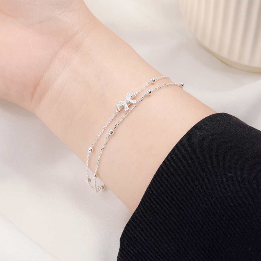 Bow - Accented Silver Bracelet | Double - Layered Whimsy for Your Wrist