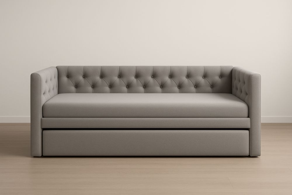 Divano letto estraibile in tessuto grigio con testiera imbottita.