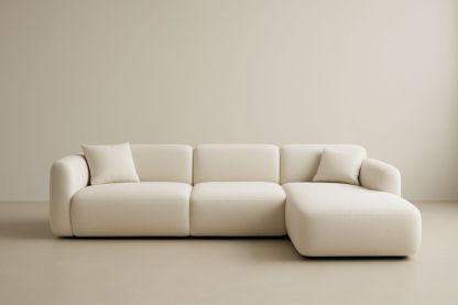 Divano angolare in tessuto beige con chaise longue