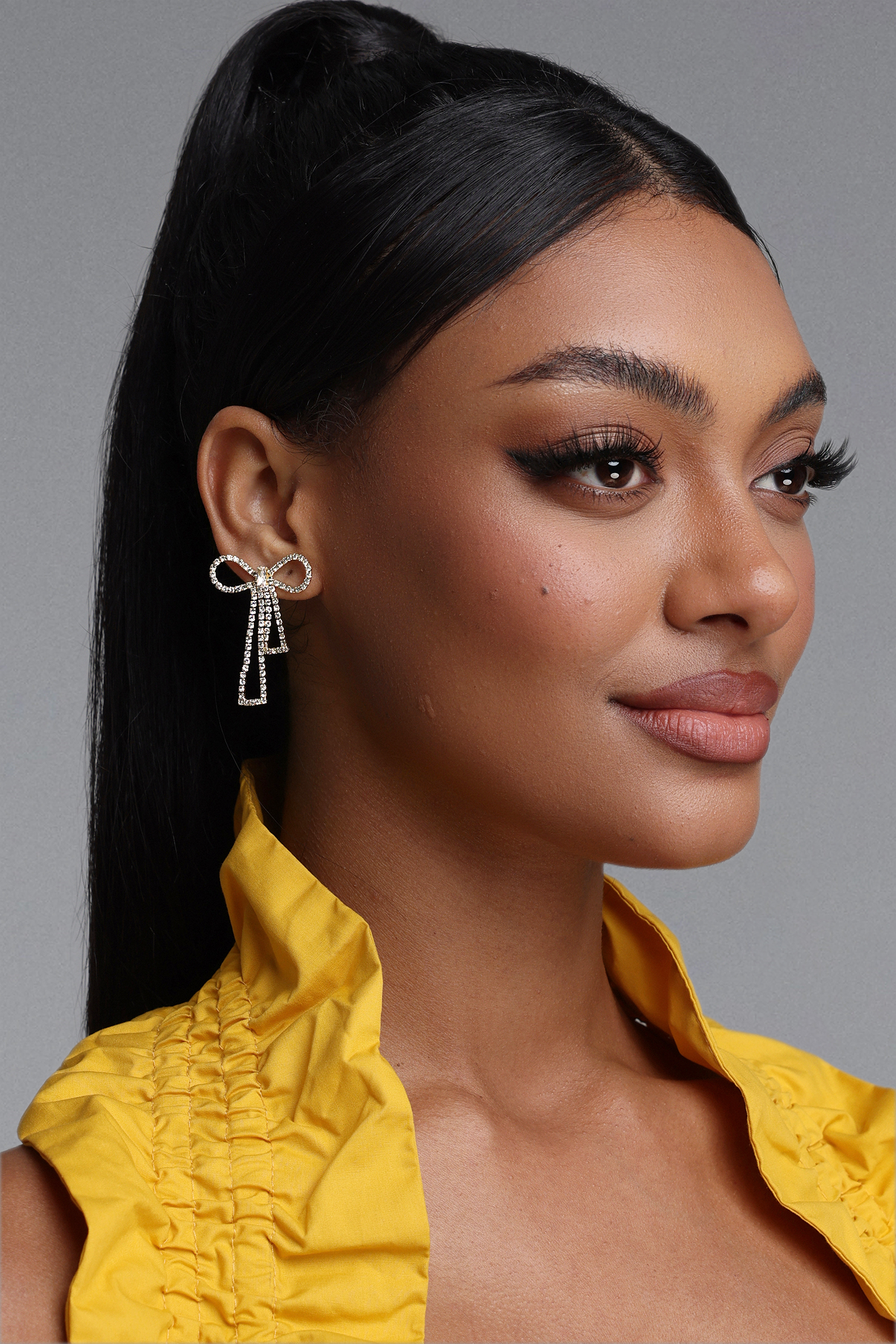 Sling Crystal Bow Tassel Earrings