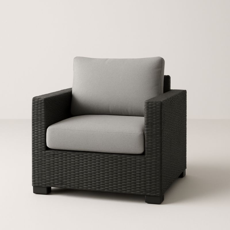 Fauteuil en rotin synthétique noir avec coussins gris