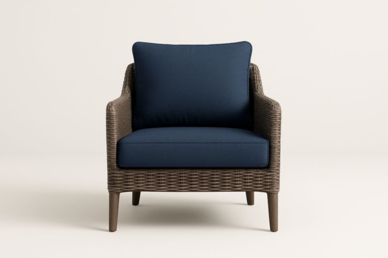 Fauteuil en rotin synthétique brun avec coussins en polyester bleu