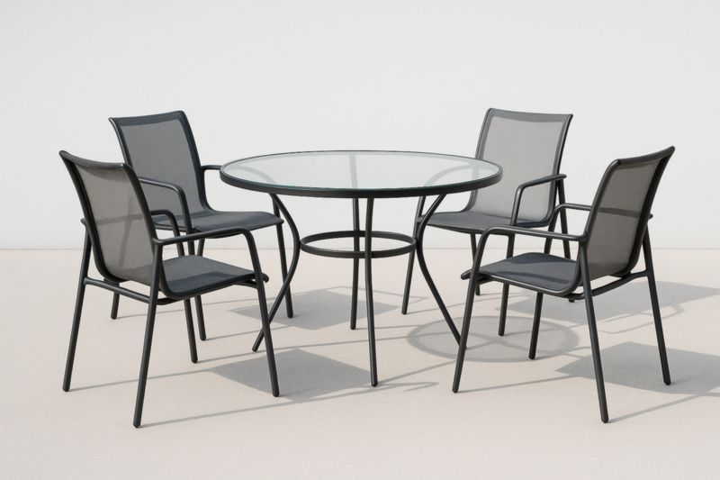 Ensemble table ronde en verre et chaises en métal noir